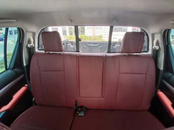 Toyotahiluxrentaldubaibyproxluxuryrentalsbackseatsinsideview min
