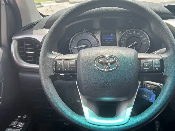 Toyotahiluxrentaldubaibyproxluxuryrentalsbackseatssteering min